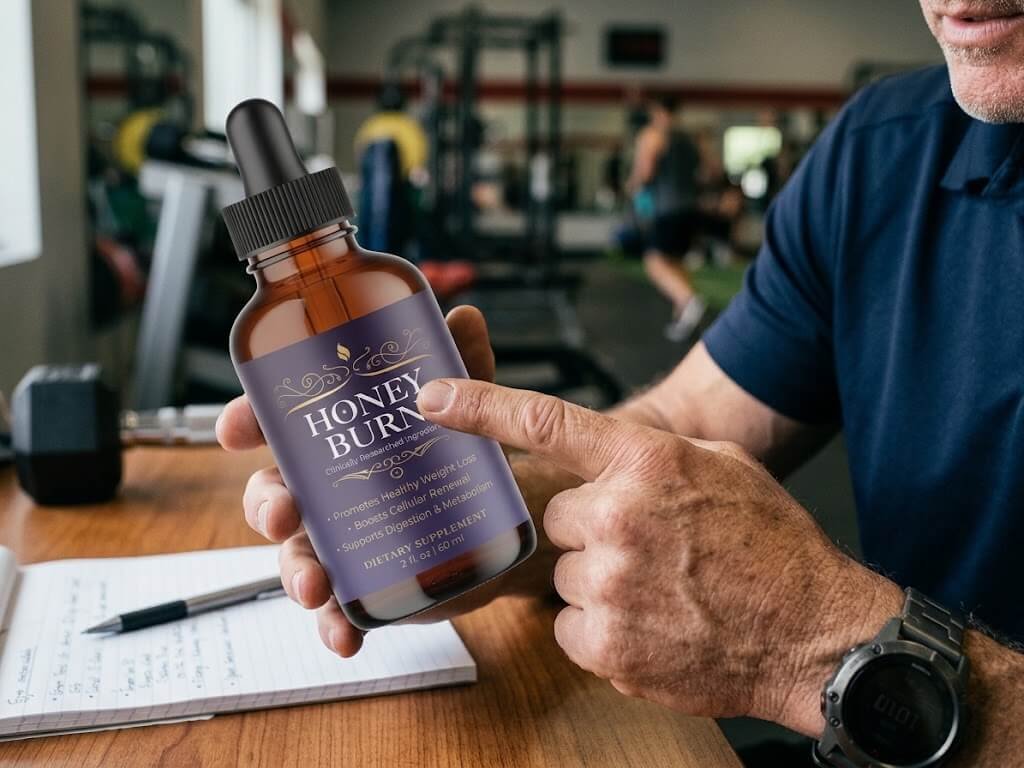 A close-up shot of a coach’s hand pointing to the "Supplement Facts" panel on a bottle, highlighting