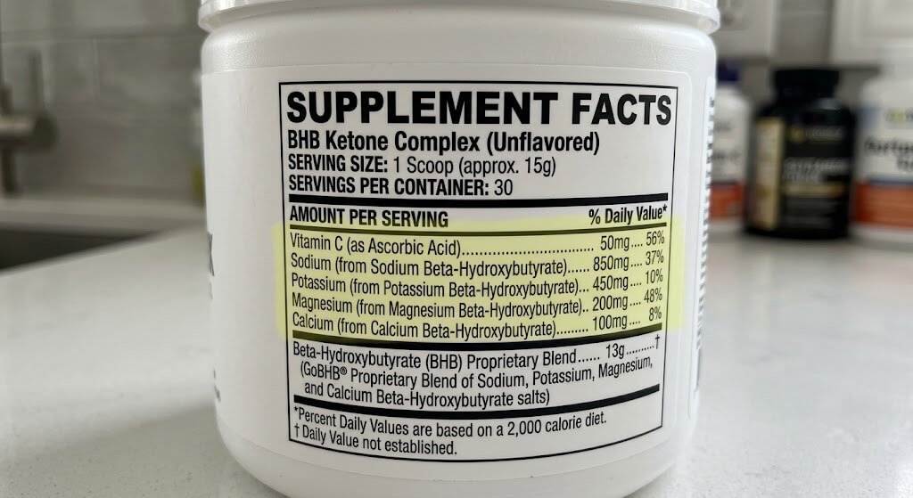 Close-up of a nutrition label on a BHB supplement tub, highlighting the sodium, potassium, and magnesium content per serving